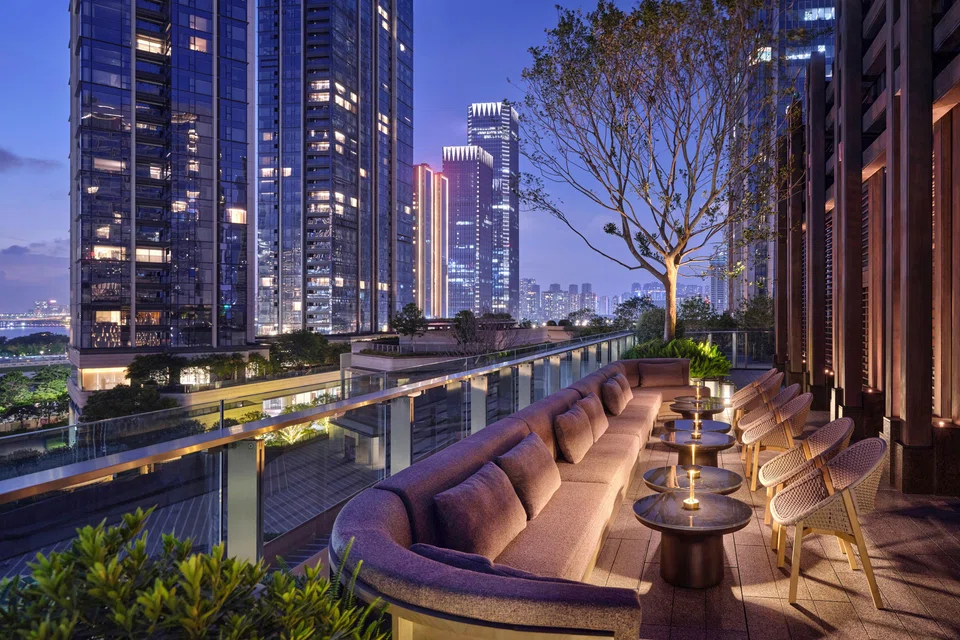 The hotel's Collective Bar boasts a stunning night view of the city.