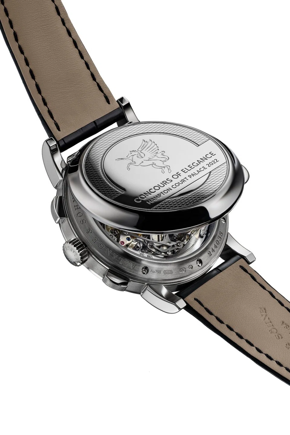 The hinged cuvette of the 1815 Chronograph “Hampton Court Edition” — hand-engraved with the Concours of Elegance logo — on the sapphire case-back conceals a hand-wound movement, the Lange calibre L951.5 launched in 2010. 