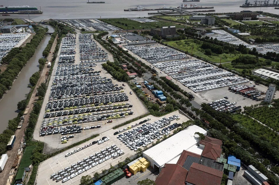 Vehicles waiting for shipment at a lot in a shipping terminal in Shanghai, China, July 25, 2024. US Treasury Secretary Janet Yellen said Beijing was channeling too much of its GDP into investment in advanced manufacturing that is flooding the world with cheap Chinese goods, adding that China’s economy was now too large to grow through that model.