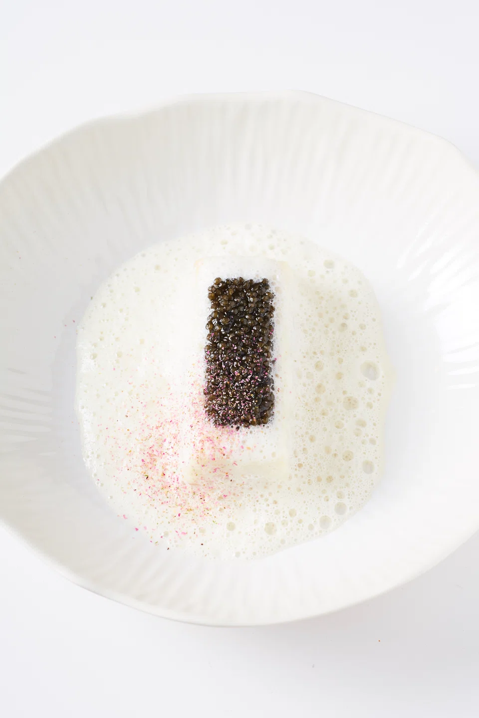 Chef Pic prepares Le Bar caviar as part of her Christmas menu at home with the family.