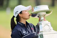 Chinese golfer Yin Ruoning kisses the trophy after winning the KPMG Women's PGA Championship in New Jersey on June 25, 2023.