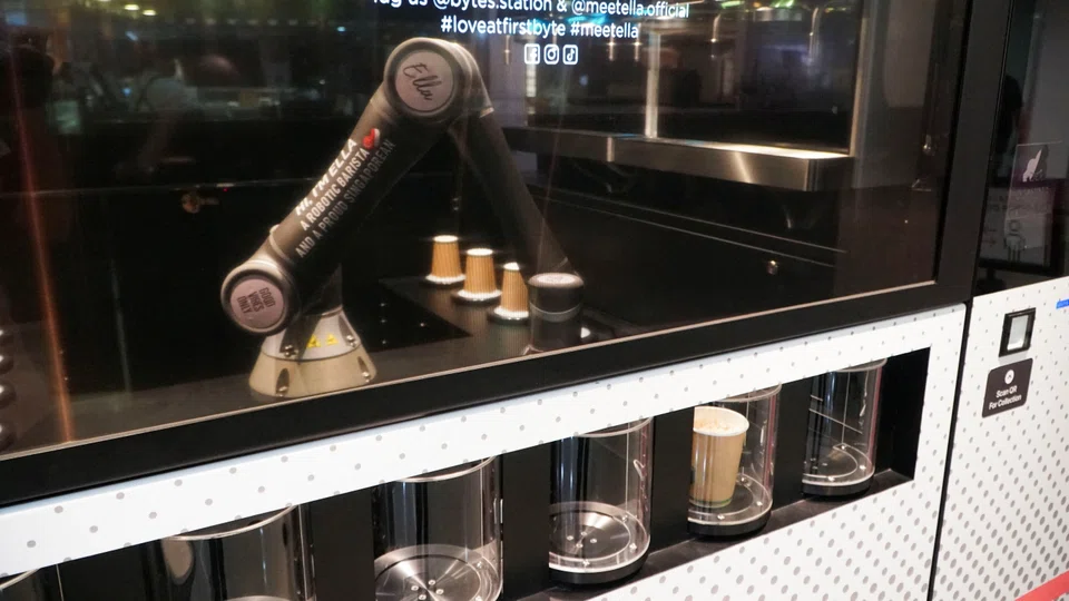 Robot barista "Ella", designed by Crown Digital, makes a coffee autonomously after receiving orders. 
