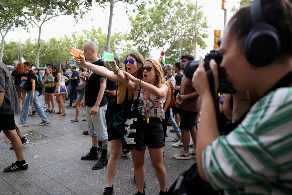 Anti-tourism protesters in Barcelona have been firing at tourists with water guns.