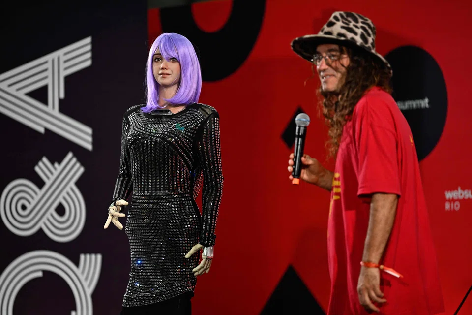 SingularityNET founder and CEO Ben Goertzel performs along with the AI robot Desdemona during the Web Summit Rio 2023 at the RioCentro Expo Center in Rio de Janeiro, Brazil on May 3, 2023. 