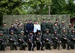 Thai Prime Minister Paetongtarn Shinawatra (in white), with military personnel during a visit at Morakot Operation Base, has faced criticism for her perceived mishandling of a border row with Cambodia, including over a phone call with the country’s former leader, Hun Sen.