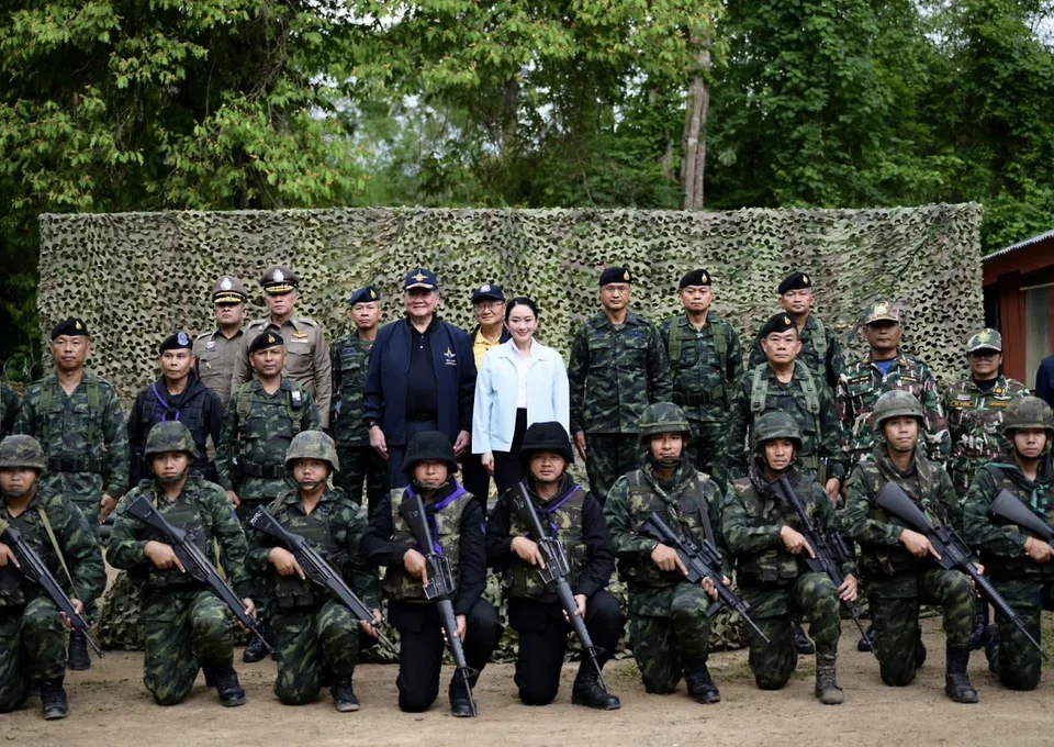 Thai Prime Minister Paetongtarn Shinawatra (in white), with military personnel during a visit at Morakot Operation Base, has faced criticism for her perceived mishandling of a border row with Cambodia, including over a phone call with the country’s former leader, Hun Sen.