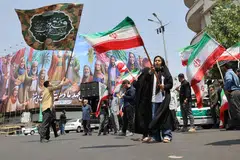 People attend an anti-Israeli protest following the Israeli strikes on Iran, in Tehran, Iran, Jun 13. 