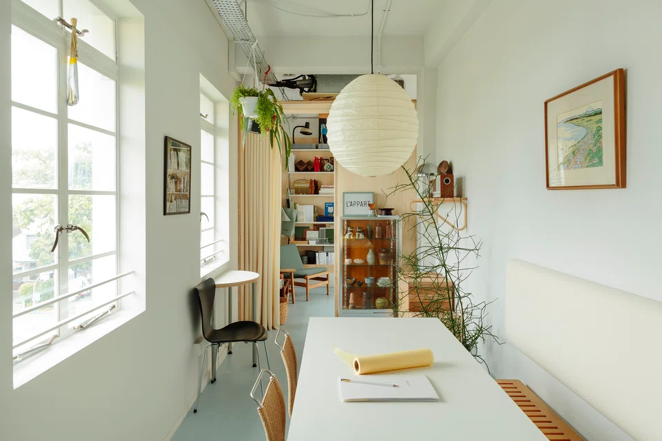 A Kvdrat beige curtain separates the meeting room from the more private workspace.