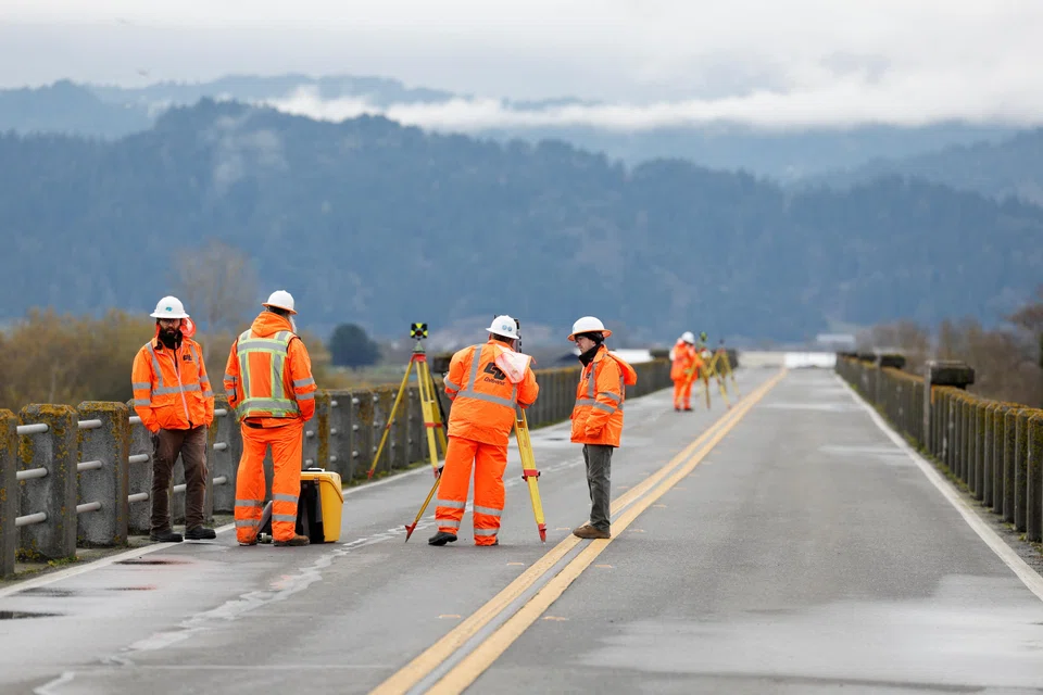 Transport workers assess damage to a bridge after a strong 6.4-magnitude earthquake struck off the coast of northern California, in Rio Dell, California, Dec 20, 2022. A 5.4-magnitude earthquake struck 15km south-east of California’s Rio Dell region, an area still recovering from a powerful earthquake last month.