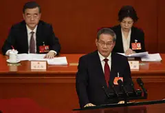 Chinese Premier Li Qiang (front) delivers his speech during the opening ceremony of the Third Session of the 14th National People's Congress of China at the Great Hall of the People in Beijing, China, March 5, 2025. 