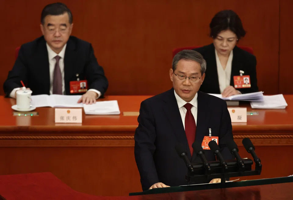Chinese Premier Li Qiang (front) delivers his speech during the opening ceremony of the Third Session of the 14th National People's Congress of China at the Great Hall of the People in Beijing, China, March 5, 2025. 