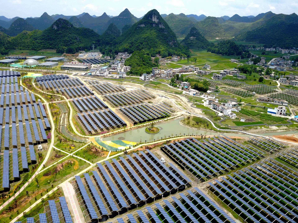 This photo taken on June 10, 2017 shows greenhouses built with solar panels on their roofs, in Yang Fang village in Anlong, in China's southwest Guizhou province.
The combination of greenhouses and solar power generation is part of a 294 million USD project which when completed will deliver 150 megawatts of electricity and provide jobs for 2000 people.