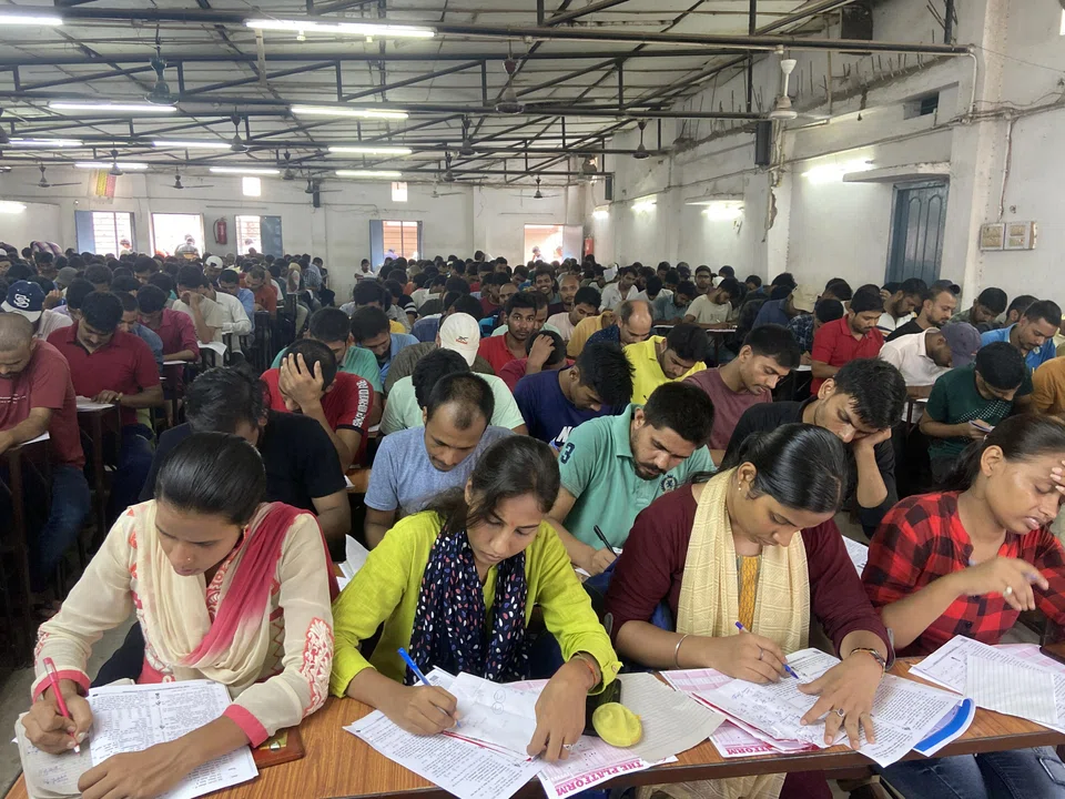 Job applicants give a mock test for railway entrance exams at Platform coaching centre at Musallahpur Haat in Patna, the capital city of the eastern state of Bihar in India in 2022. Over half of India’s 1.4 billion people are aged under 30, according to government health figures. 