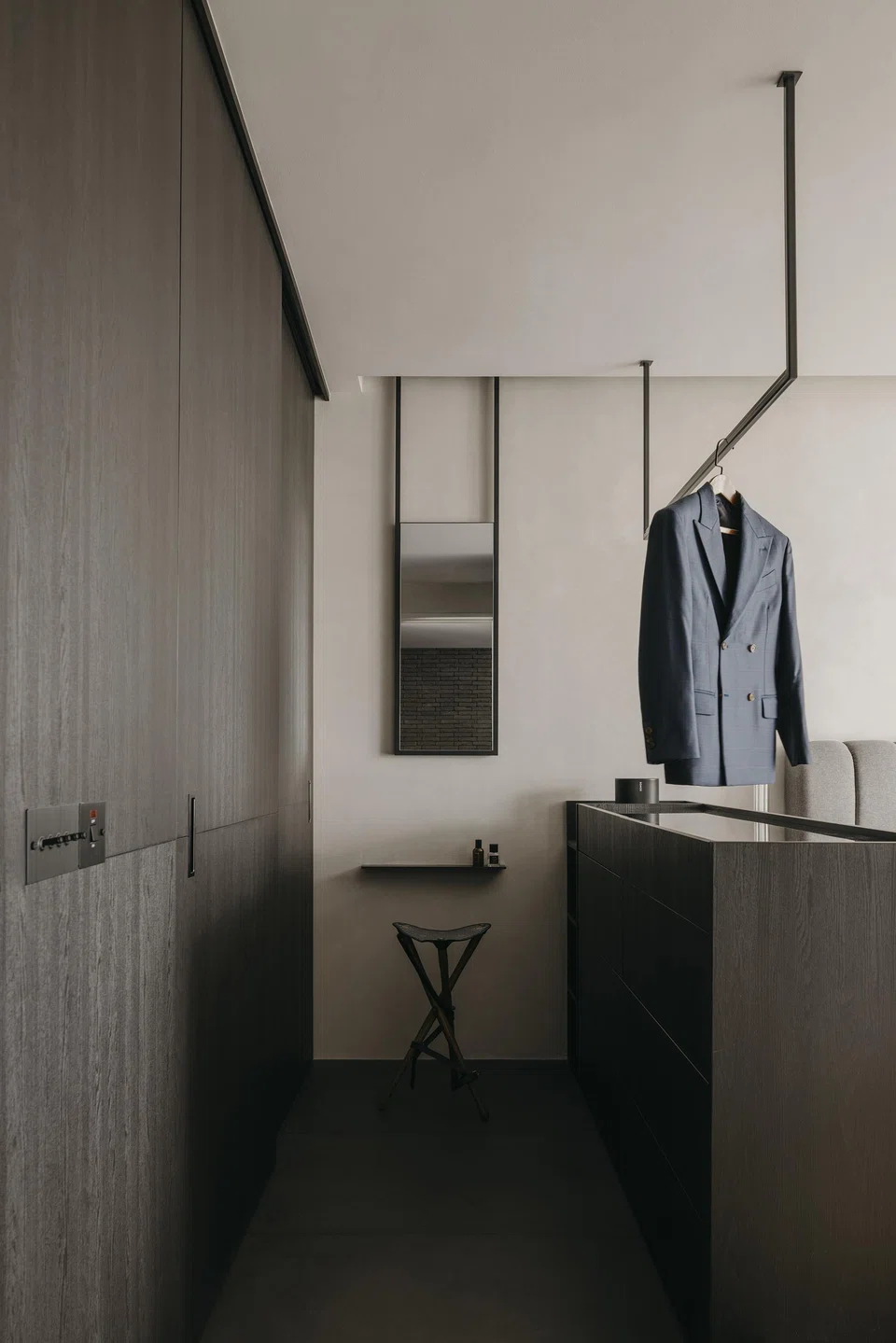 A streamlined yet functional wardrobe area in the master bedroom. 