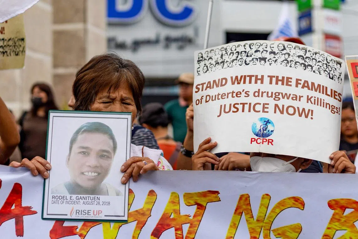 Protesters demonstrate demanding justice for drug war victims, after the arrest of Duterte, in Quezon City on March 11.