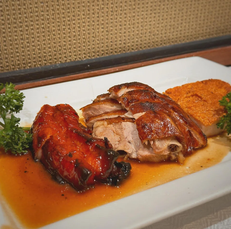 A combination roast platter features char siew, siew yoke and roast duck.