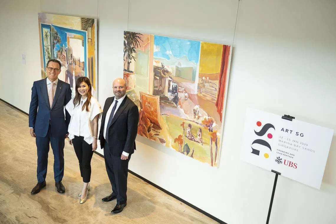 (From left) August Hatecke, co-head Global Wealth Management Asia Pacific and country head UBS Singapore; Art SG fair director Shuyin Yang and Art SG co-founder Magnus Renfrew pose before a UBS-commissioned painting by Hilmi Johandi.