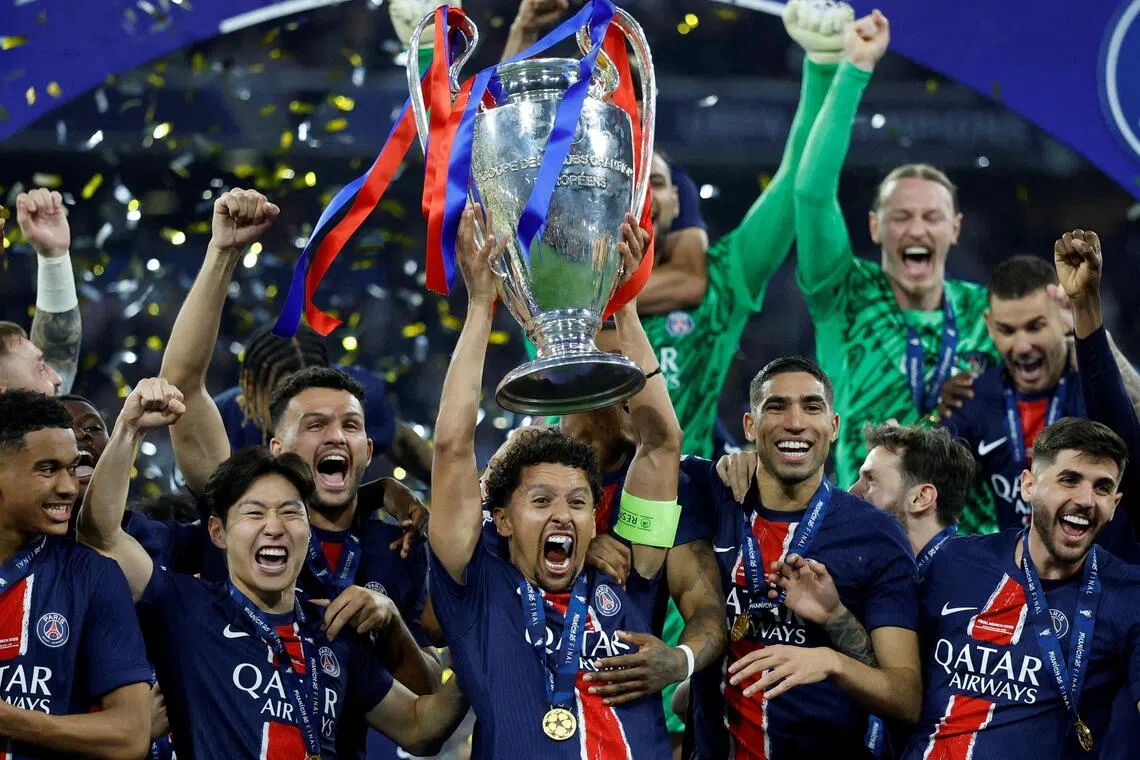 PSG captain Marquinhos lifts the trophy after leading the team to a 5-0 win over Inter in the Champions League final in Munich.
