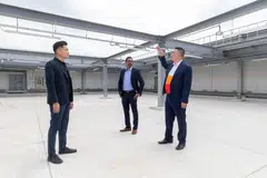 PacificLight's deputy general manager of business development, Thomas Lim (right) showing where the solar panels will be located. With him are JTC’s group director of new estates Nelson Liew (left) and Univers' director of delivery lead Zahir Siddique.
