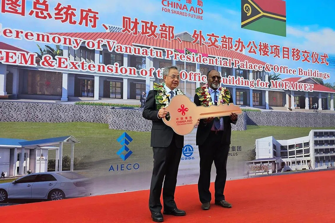 Vanuatu Prime Minister Charlot Salwai (right) receiving a key from Hu Chunhua, vice-chairman of the 14th National Committee of the Chinese People’s Political Consultative Conference, during an official handover ceremony of the new presidential palace to the government of Vanuatu.