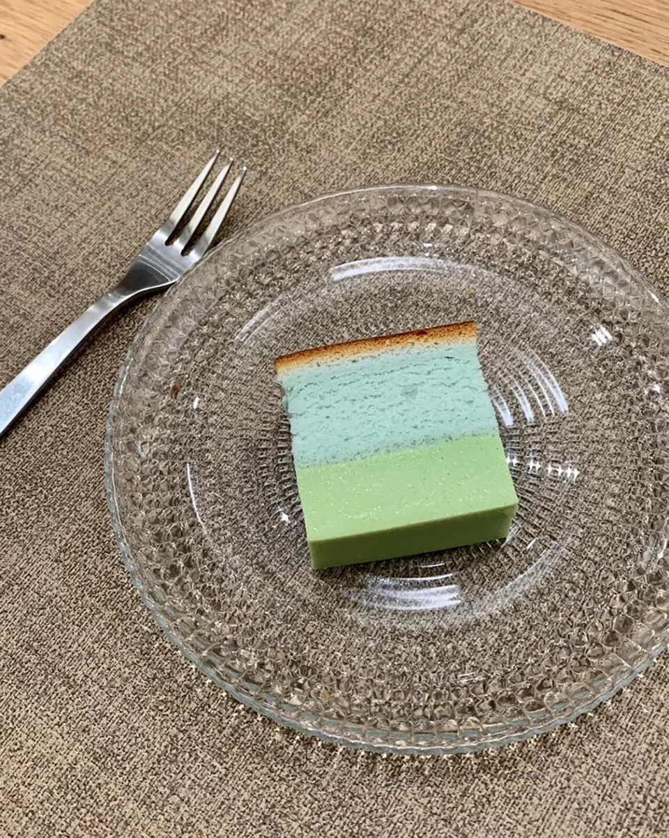 A dreamy slice of fluffy chiffon cake on top of pandan custard in this version of kuih sarlat.