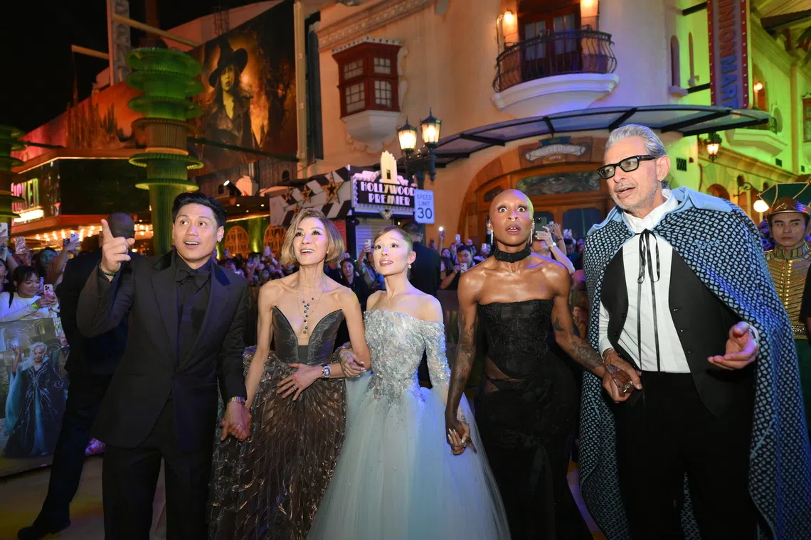 From left: Director Jon M Chu and cast members Michelle Yeoh, Ariana Grande-Butera, Cynthia Erivo and Jeff Goldblum on the yellow carpet at the film's Singapore premiere.