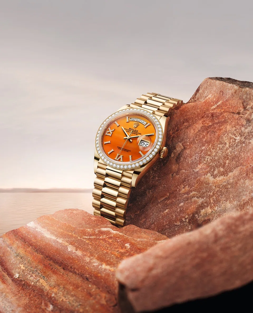 Oyster Perpetual Day-Date 36 in 18 ct yellow gold, with a carnelian, diamond-set dial, diamond-set bezel and a President bracelet.