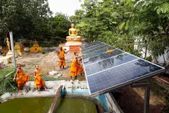 A Buddhist monk and novices cleaning solar panels at a temple in Thailand. Industry players note that displaced demand from the US could expand the domestic use of solar products and scale up intra-Asean sales.