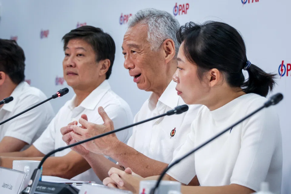 SM Lee Hsien Loong (second from right) said on Saturday: "When we field somebody as a candidate, we must make sure that we are completely convinced he is going to do his best for the residents, and is the right candidate for that place."