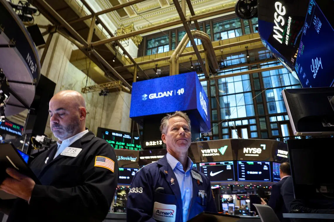 Traders work on the floor at the New York Stock Exchange (NYSE) in New York City, U.S., December 2, 2024.  REUTERS/Brendan McDermid      
