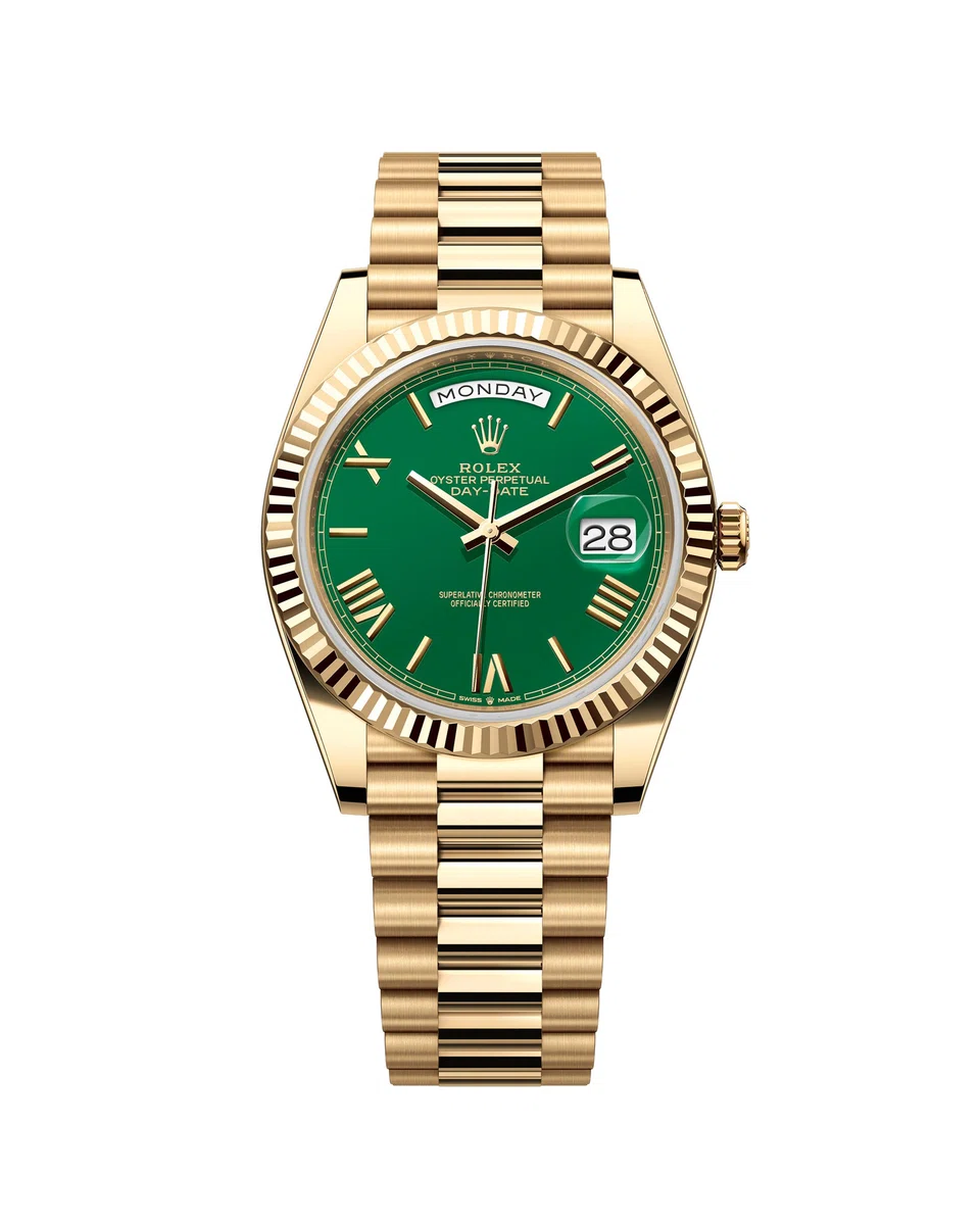 The Oyster Perpetual Day-Date 40 in 18-karat yellow gold with a green dial, fluted bezel and President bracelet.
