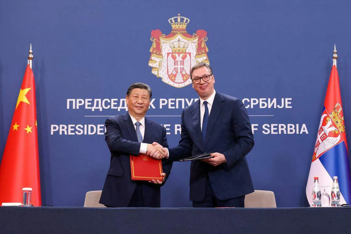Serbian President Aleksandar Vucic and Chinese President Xi Jinping shake hands on the day of their meeting, as part of the Chinese president's two-day state visit in Belgrade, Serbia.