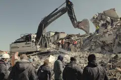 Volunteers search for bodies in the old quarter of Antakya, Turkey, three days after the earthquake, Feb 9, 2023. 