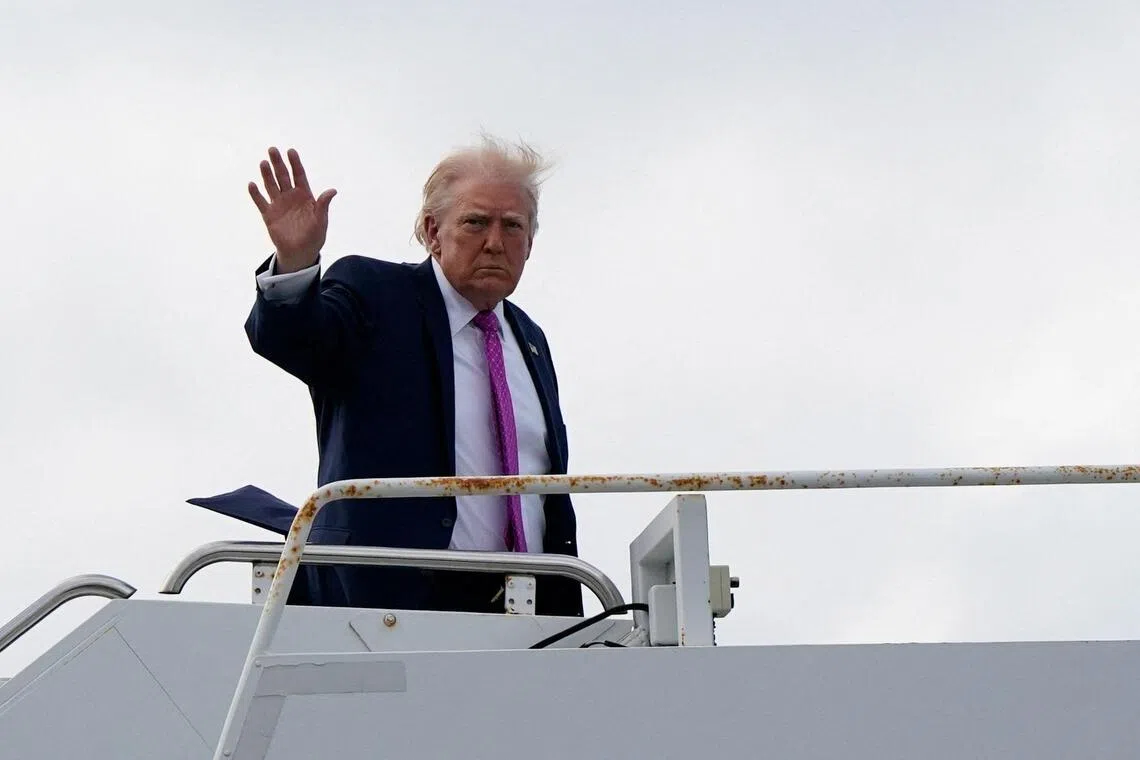 US President Donald Trump waves as he boards Air Force One at Palm Beach International Airport in West Palm Beach, Florida, March 29, 2026. 