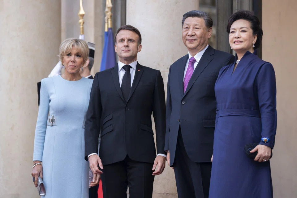 France's president Emmanuel Macron (second from left), Chinese president Xi Jinping (second from right), and their spouses, ahead of the state dinner marking the Chinese leader's visit at the Elysee Palace in Paris, France, on May 6. 