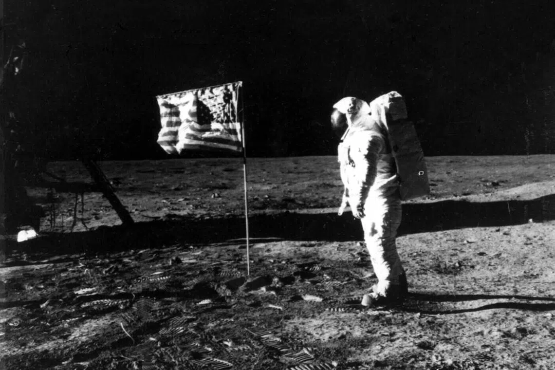 Astronaut Edwin Aldrin stands by the American flag on the lunar surface during the Apollo 11 mission in July 1969.