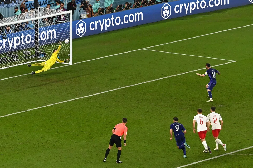 Poland's goalkeeper Wojciech Szczesny saves a penalty from Argentina's Lionel Messi during the Qatar 2022 World Cup match between Poland and Argentina at Stadium 974 in Doha. Nov 30, 2022. 