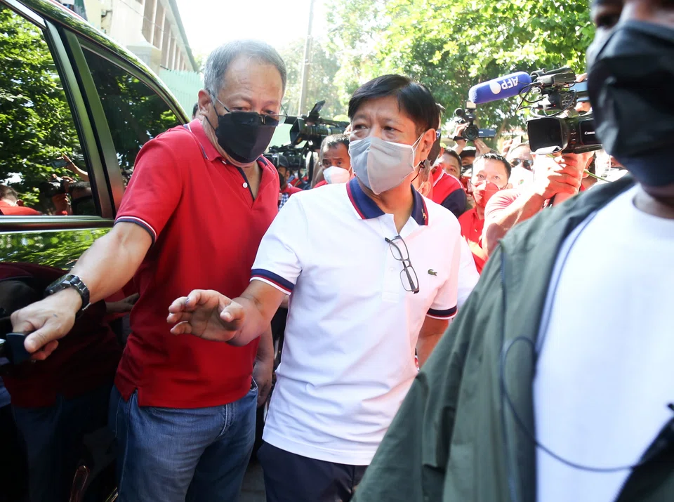Presidential candidate Ferdinand 'Bongbong' Marcos Jr, the son of former president Ferdinand Marcos, boards a vehicle after casting his ballot at an elementary school turned into a voting precinct in the town of Batac in the Ilocos Norte province on Monday (May 9).  Some 67 million Filipinos are expected to vote for nationa​l and local government leaders in these polls.   
