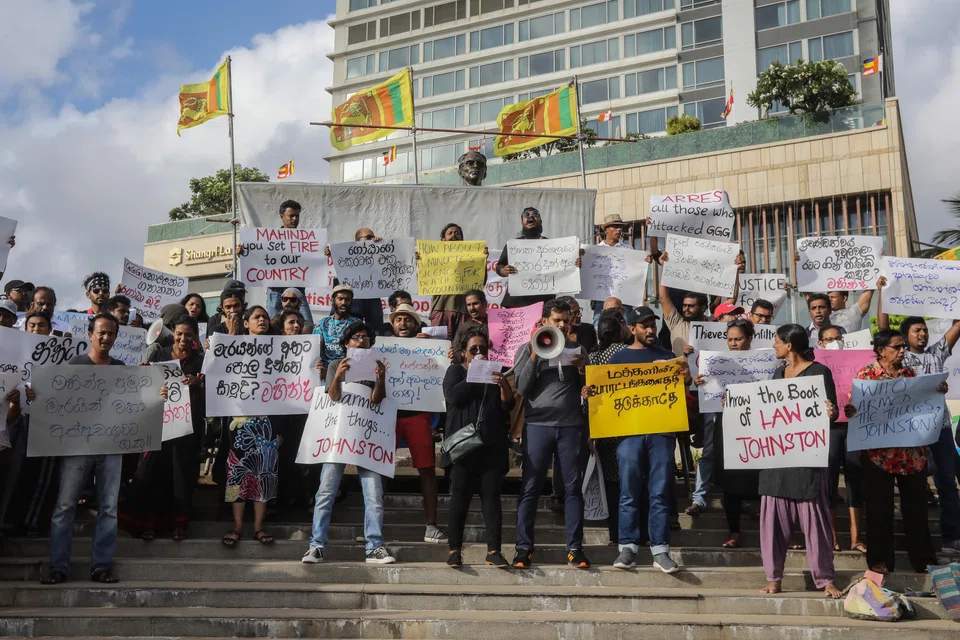 Sri Lankan protesters in 2022, calling for the president to resign over the economic crisis. Sri Lanka has faced long delays in receiving debt relief, because their Chinese creditors refuse to agree to the debt-restructuring terms agreed in the Paris Club.