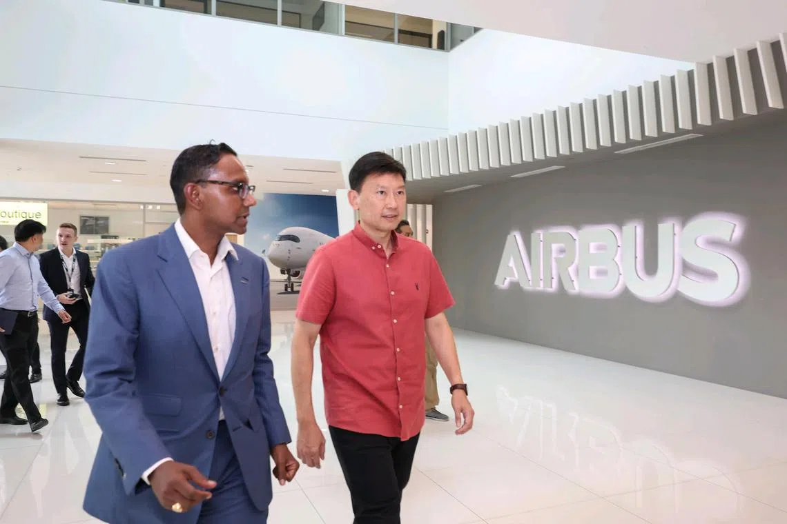 Anand Stanley (left), president and head of region, Airbus Asia-Pacific; and Minister for Transport Chee Hong Tat touring the Airbus Asia Training Centre on May 7, 2025. 