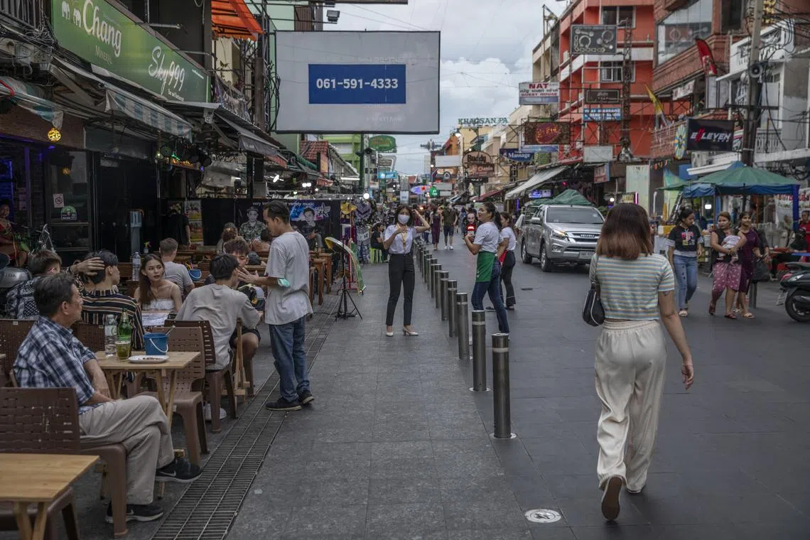 Tourists outside a restaurant on Khaosan Road in Bangkok..