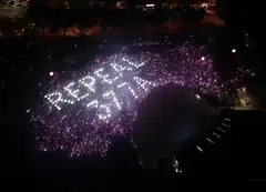 Attendees of the 2019 Pink Dot SG event hold up lights to form a message calling for the repeal of Section 377A of the Penal Code. Singapore will repeal the colonial-era law, but will also amend the Constitution to prevent challenges to the legal definition of marriage.