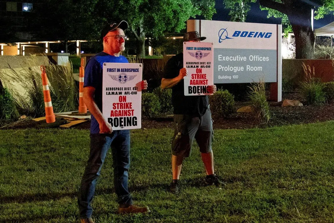 Workers protest during a walkout by members of the International Association of Machinists and Aerospace Workers (IAM) over contract negotiations, outside Boeing company's facility, Berkeley, Missouri, Aug 4, 2025. 