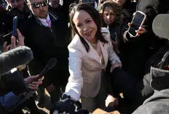 Venezuelan opposition leader Maria Corina Machado greets supporters as she departs the White House following a meeting with U.S President Donald Trump in Washington, D.C., Jan 15, 2026. 