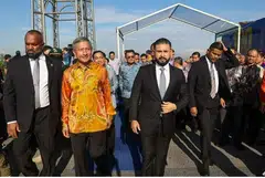 Minister for Foreign Affairs Vivian Balakrishnan (left) and the Regent of Johor, Tunku Ismail, during the commemoration ceremony held at the midpoint of the Causeway on Jun 28. 