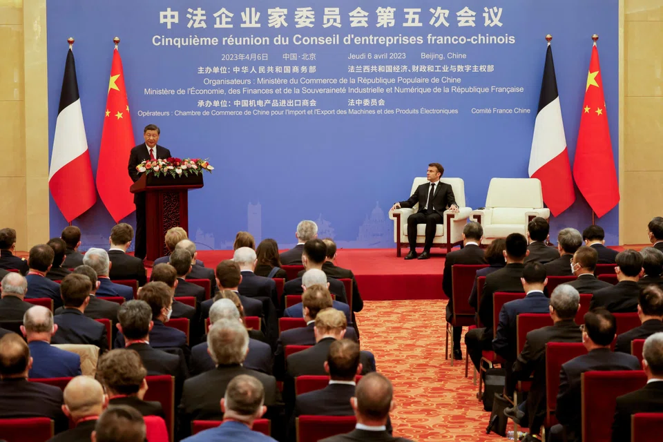 Chinese President Xi Jinping and French President Emmanuel Macron at a Franco-Chinese business council meeting in Beijing on Apr 6. Macron was accompanied by more than 60 business executives on his recent trip to China. 