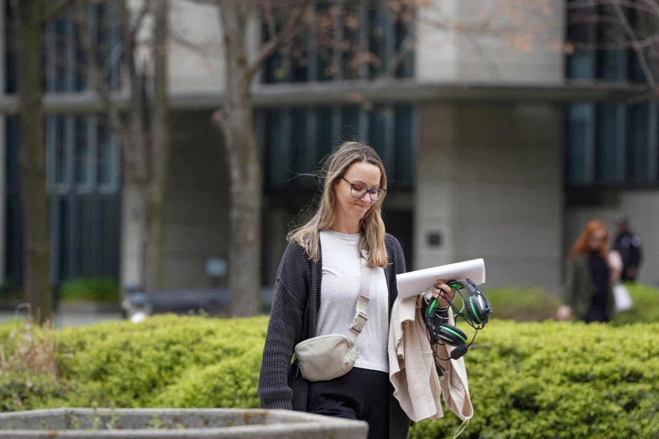 A woman, who worked at the US Department of Education leaves the Sam Nunn Atlanta Federal Centre, after the Trump administration began mass layoffs of thousands of employees, Atlanta, Georgia, April 2, 2025. 