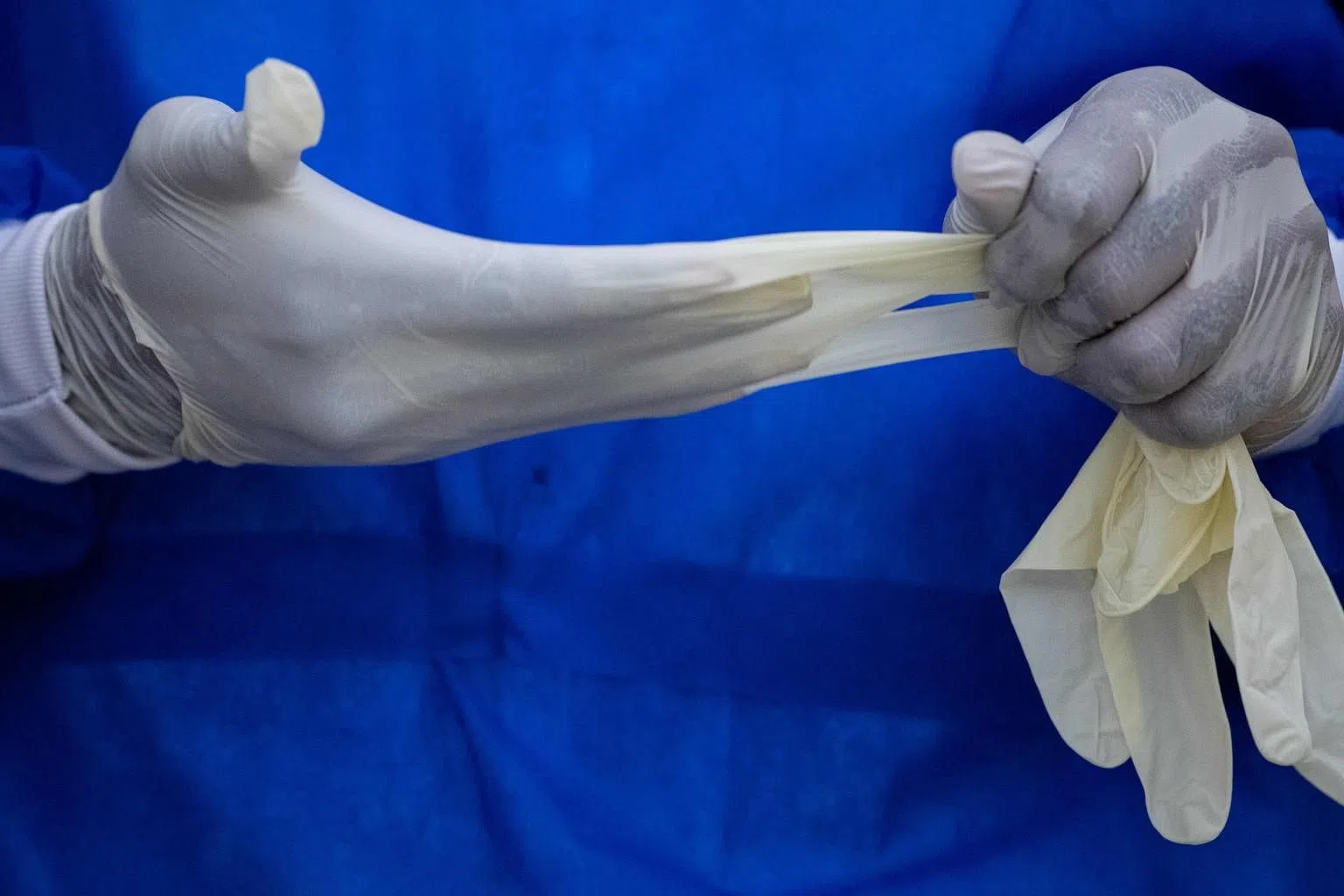 Malaysian rubber glove group says demand to outstrip supply until 2023