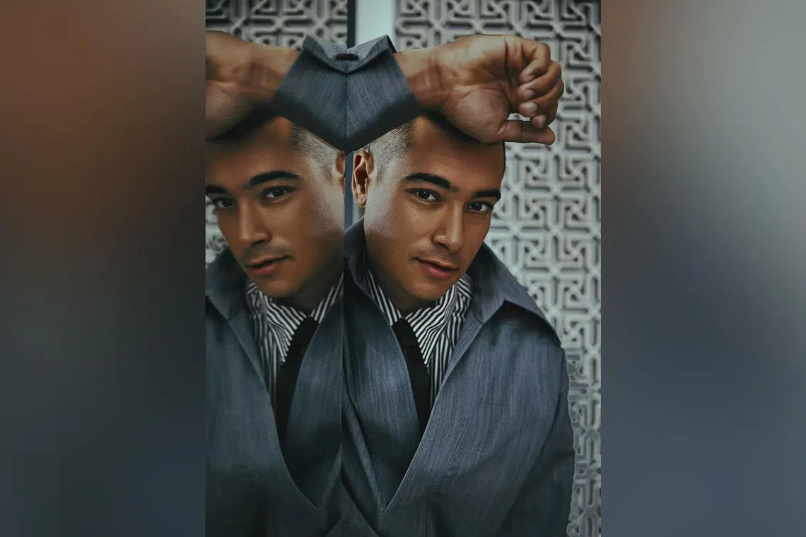 Rene Vijay Shrestha Einhaus in a grey wool overshirt, striped cotton shirt, and black leather tie, all from Bottega Veneta.