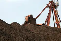 Iron ore futures fell 3 per cent to US$98 a tonne early afternoon in Singapore, following downbeat news from China's property sector.